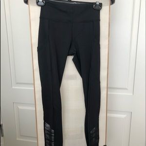 Black Lululemon tights with black mesh detail